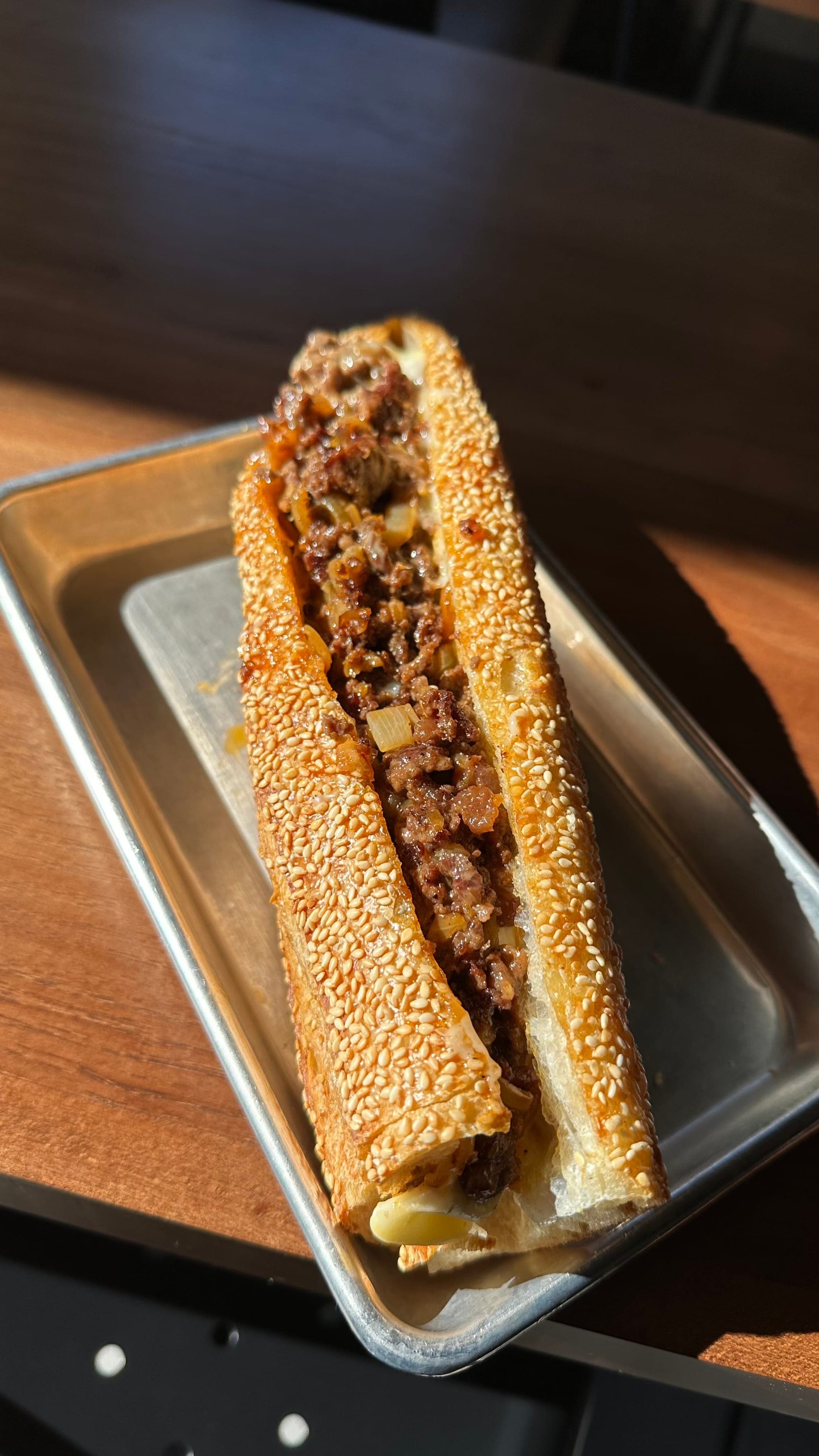 Hayden's signature cheesesteak on a sesame seed baguette